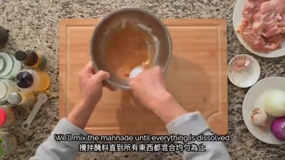 Stirring the bowl of seasonings, cornstarch, and minced ginger