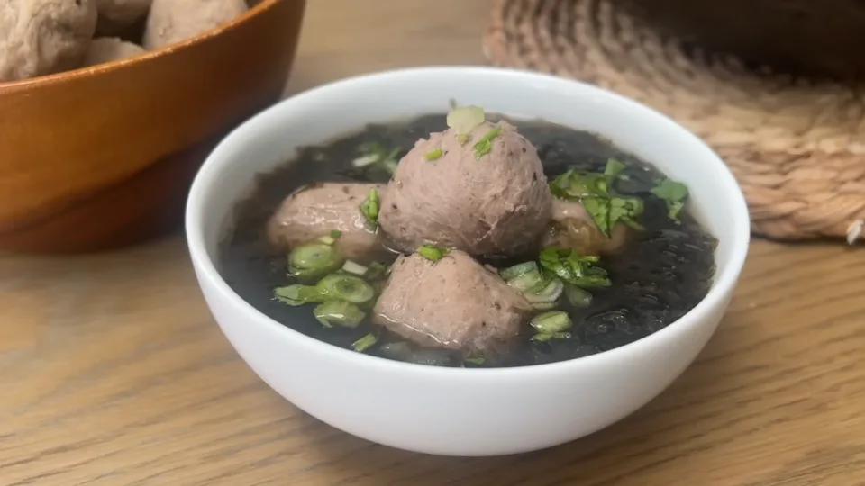 Simmer in clear soup and serve
