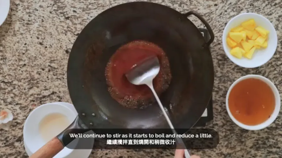 Simmer sweet and sour sauce and thicken with slurry